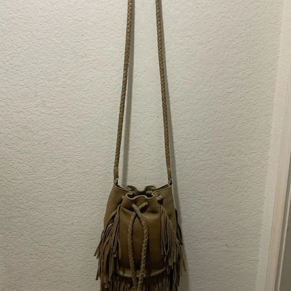 Cut N' Paste Women Gray Leather Drawstring braided fringes strap bag